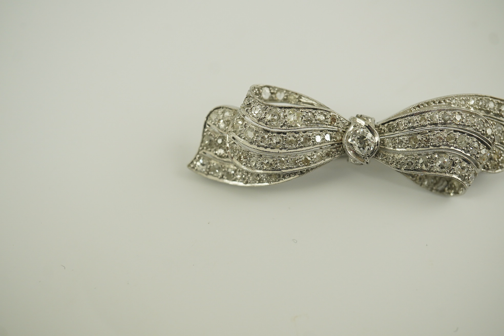 A 1940's platinum? and diamond cluster set ribbon bow brooch